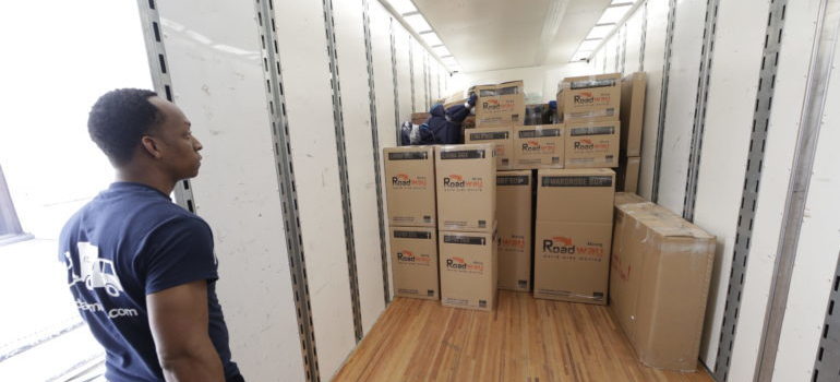 a mover and many packing boxes