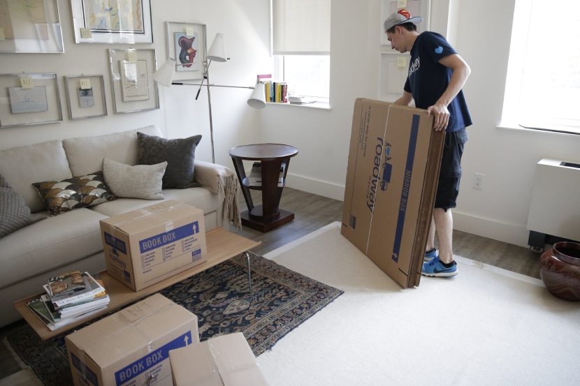 Roadway's mover labelling and carefully packing items during a move in NYC