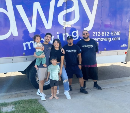 Happy customers with Roadway Moving's crew