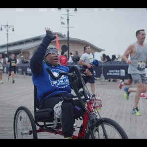 Hand-cyclist-celebrating-while-crossing-the-finish-line.jpg