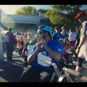 Hand-cyclist-fitting-his-helmet.jpg