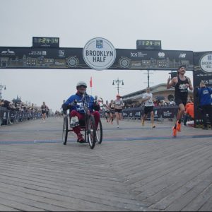 Long-shot-of-Hand-cyclist-crossing-the-finish-line-e1691786130357.jpg