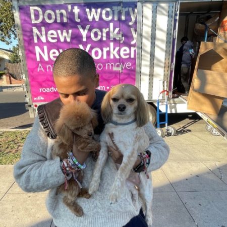 happy-customer-with-his-two-dogs-during-a-move-with-roadway.jpg