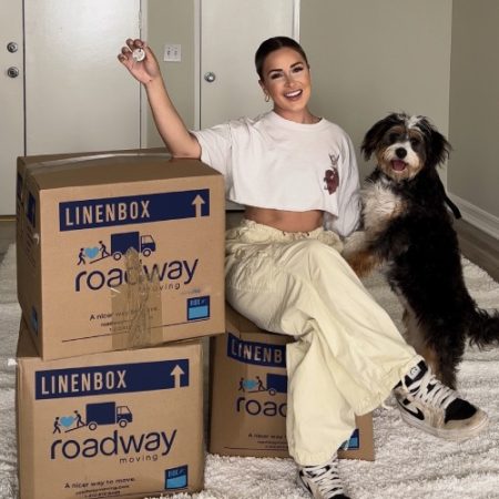 megan-moore-with-her-dog-during-a-move-with-roadway.jpg